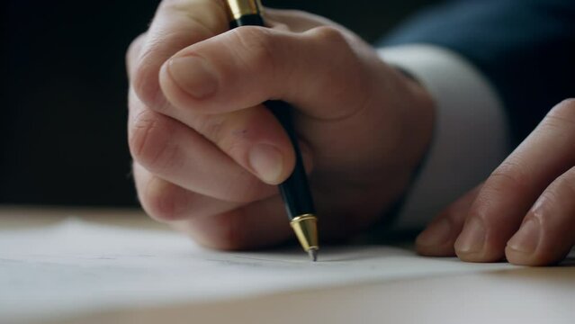 Hands putting signature document at desk close up. Director signing contract.