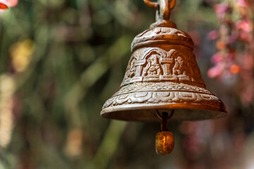 Old bronze bell in indian temple with blur background. Hindu temple brass bell hanging in gold color