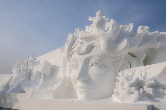 01.01.2022, Harbin, China. Panoramic image with copy space for text of the Sno queen. Statue in Ice and snow world
