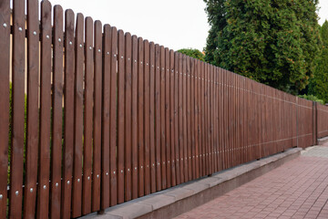 Fototapeta premium Beautiful wooden fence and trees near pathway outdoors