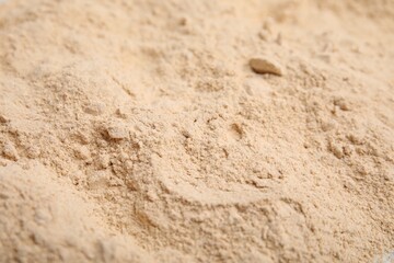 Pile of sesame flour as background, closeup