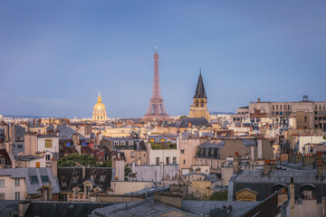 Eiffel Tower and french roofs architecture from above at sunrise, Paris, France