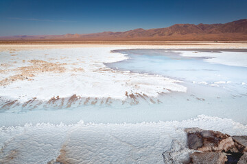 Salt lake, volcanic landscape at sunrise, Atacama, Chile border with Bolivia