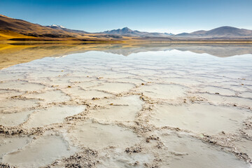 Salt lake, volcanic landscape at sunrise, Atacama, Chile border with Bolivia