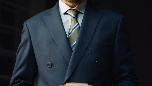 Successful financier counting salary in euro close up. Man calculating banknotes