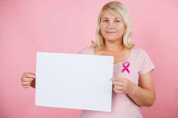Woman doctor take bliiboard and show something with breast cancer prevent concept.