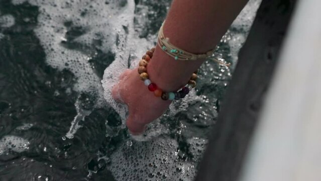 Point Of View Of Woman Dangling Hand In Sea From Boat - Thulusdhoo, Maldives