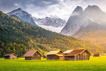 Fototapeta na wymiar Bavarian alps and rustic farm barn, Garmisch, Zugspitze massif, Bavaria, Germany
