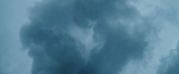 Dramatic cloudscape texture. Dark heavy thunderstorm clouds before rain. Overcast rainy bad weather. Storm warning. Natural blue background of cumulonimbus. Nature backdrop of stormy cloudy sky.