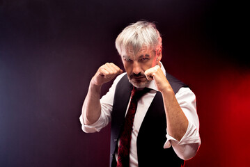 Caucasian Business Man in waistcoat suit standing in a fight stance in guard ready to hit the...