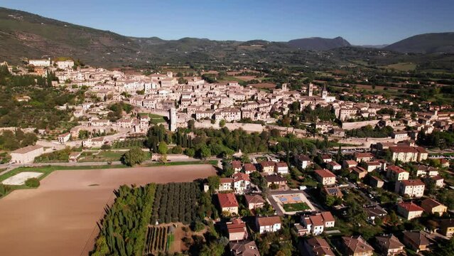 Aerial tilt up reveal of small medieval town Spello in Umbria, Italy