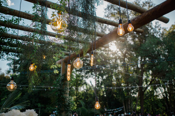pergola with light fixtures with filament bulbs