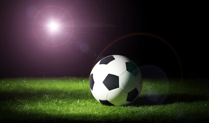 Fototapeta na wymiar Soccer ball on the grass. Sport background.