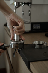 Close-up of hand Barista cafe making coffee