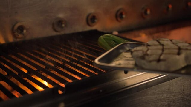 Cheff grills tuna, with flames