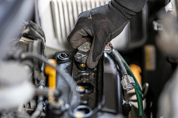 Fototapeta na wymiar Change spark plugs at an auto-differential service shop.