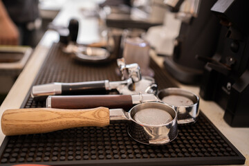 Banner of Asian Barista tamping the portafilter and preparing cup of coffee