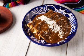 Chicken enmoladas. Also known as mole poblano enchiladas, they are a typical Mexican dish that is very popular in Mexico and the rest of the world.