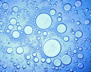water drop on the oil , abstract background