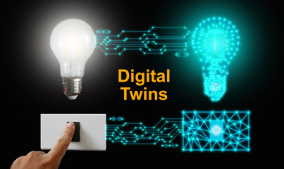 Digital twins concept. A light bulb and its mirrored body are controlled or switched on by one...