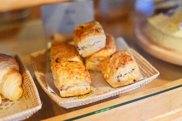 scones on wooden plate, scones for dessert - fresh homemade butter scones in bakery cake shop