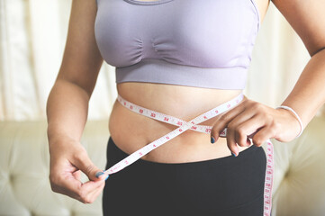 Fat woman measuring , fat woman fat belly chubby paunchy sport recreation health care lose belly...