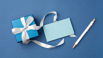 Paper card and gift box with white bow ribbon, mockup