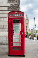 Fototapeta na wymiar Red telephone box on a street in London