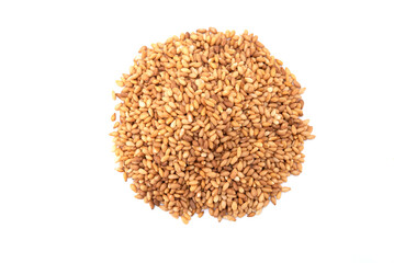 Top view of golden sesame seeds isolated on white background