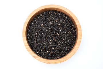 Top view of black sesame seeds in wooden bowl isolated on white background