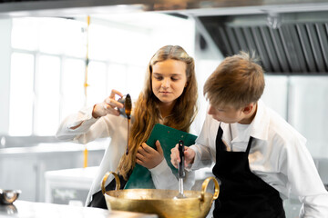 Students are learning to cook in a culinary institute with a standard kitchen and complete equipment. And have a professional chef as a trainer.