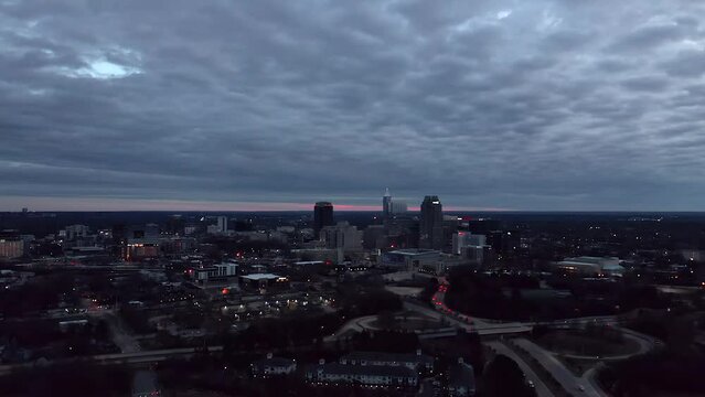 Aerial view of Raleigh NC on cloudy day. Drone shot from city suburb in America.