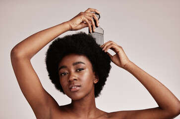 Afro comb, black woman and portrait of a model with hair care, salon and cosmetics. Hairdresser...