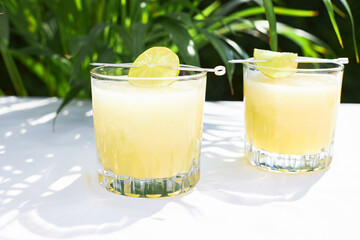 Refreshing summer cocktail, melon smoothie with ice and lime. The concept of vegetarian summer drinks. Ideal for detox