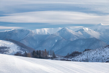 Winter snowy landscape with mountains in background. The Mala Fatra national park in Slovakia, Europe.