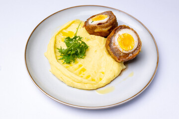 Minced meat with egg with mashed potatoes, scotch egg