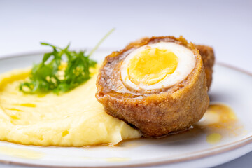 Minced meat with egg with mashed potatoes, scotch egg