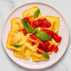 Delicious appetizing ravioli with tomato sauce and basil
