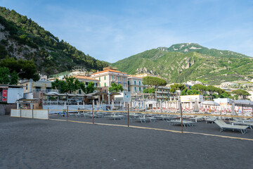 Fototapeta na wymiar Beach Chairs and Umbrellas on The Maiori Beach, Amalfi Coast, Campania, Italy