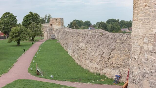 The towers and wall of the Izborsk fortress. Pskov region, Russia. Time-lapse.