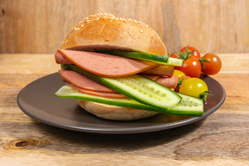 Sandwich with Bologna Sausage and fresh cucumber for fast snack.  © Iryna