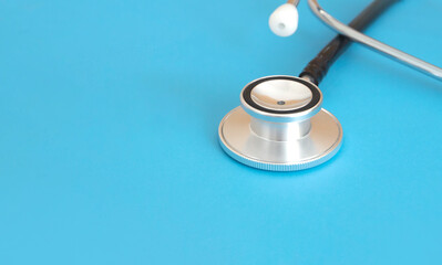 medical instrument stethoscope on blue background , health check concept 
