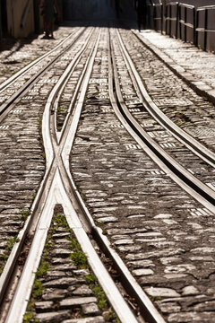 Railroad tracks on city street, Lisbon, Portugal