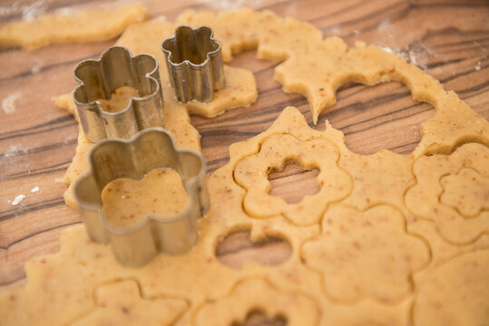 Dough rolled out and various shape cookies cut out with different cutters, Munich, Bavaria, Germany