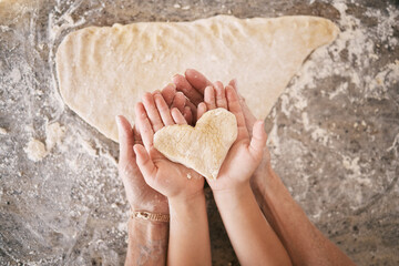 Top view, hands and heart with parent baking with kid, teaching and bonding together, weekend break...