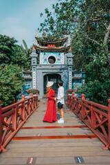 Asian travel to The Huc bridge entrance to Ngoc Son temple on Hoan Kiem lake, Hanoi, Vietnam