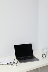 Concept of workspace with laptop, space for text