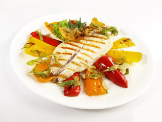 Grilled Fish Fillet with roasted Peppers and Vegetables - Low Carb Sea Food Plate isolated on white Background