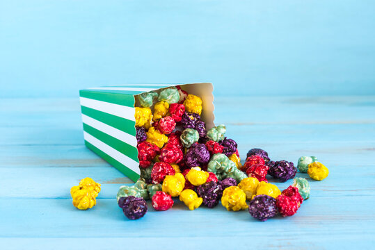 Food background with colorful caramelized popcorn.