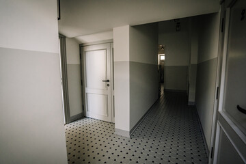 Entrance door and wardrobe in luxury apartment. Modern interior. Grey colors.